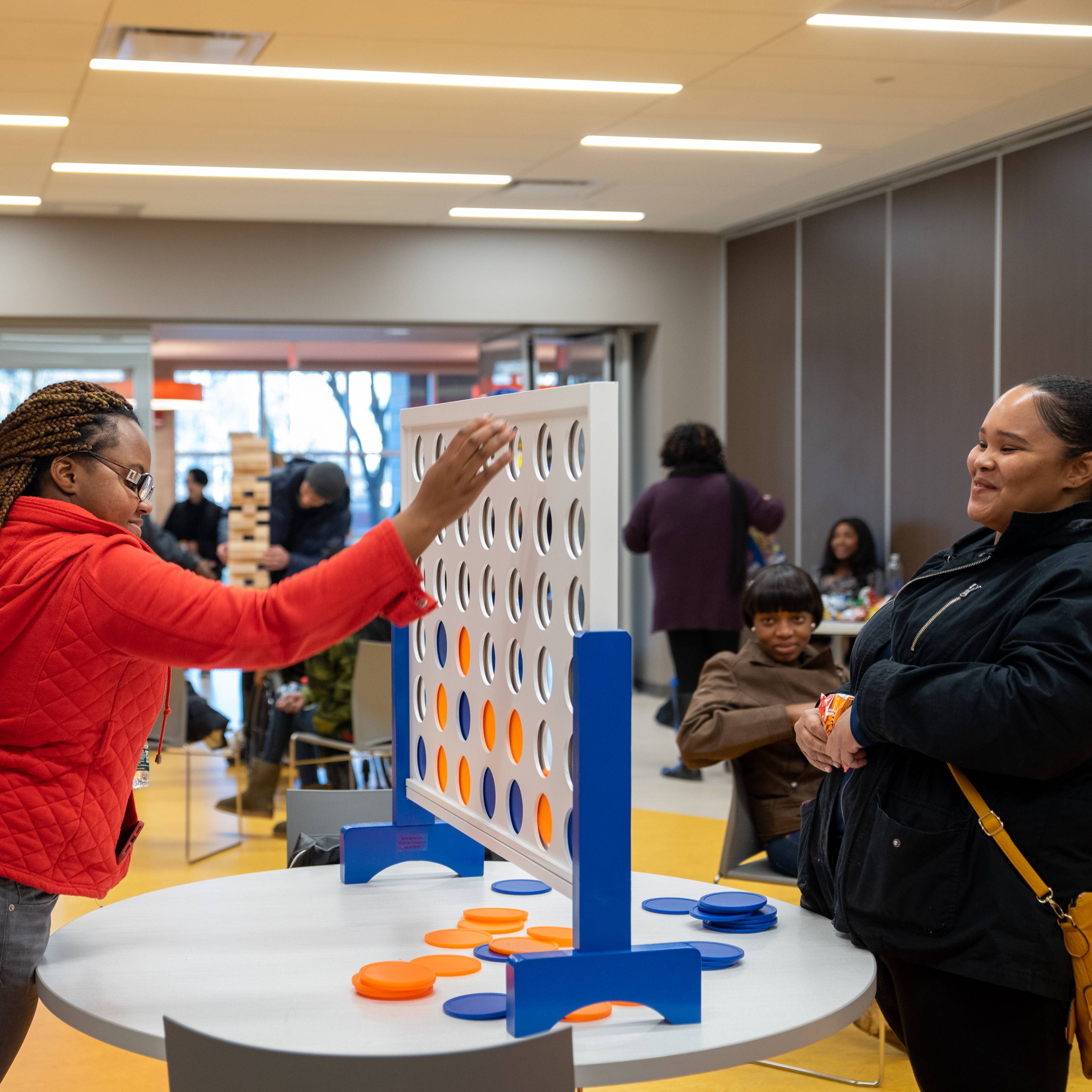 Students playing connect four