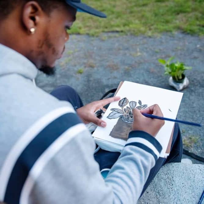 Student sketching a drawing
